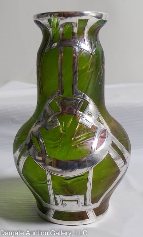 LOETZ ART GLASS VASE WITH STERLING OVERLAY: A Loetz art glass vase with sterling overlay, iridescent Papillion green. / Measures: 5.5" H x 3.5" W / Condition: No chips, cracks or repairs** Condition update: No chips or cracks to glass, no damag