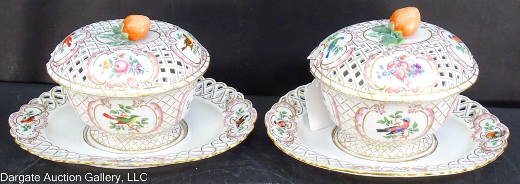 PAIR 1850's MEISSEN COVERED TUREENS: A pair of hand painted Meissen tureens ca. 1850. Featuring birds and floral patterns, reticulated underplated and lids. Strawberry finials. One tall (7"Hx11"Wx8"D); one short (5.5"Hx10.5"Wx8.5"D). Mar