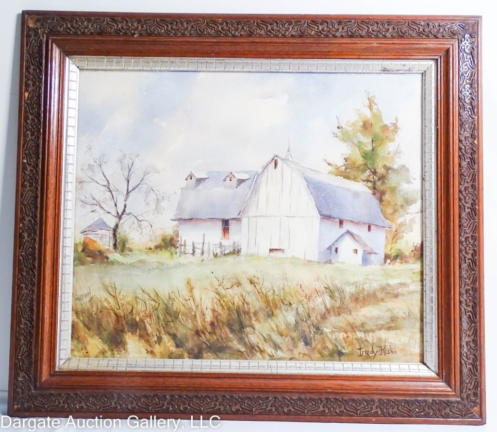 TRUDY KAHN WATERCOLOR PASTORAL SCENE: Trudy Kahn (American/OH, 20th Century) Kahn is a Maumee Ohio artist / Watercolor on paper landscape or pastoral scene with a barn on a hill with a copse of trees. Set under glass in gesso oak wood fra