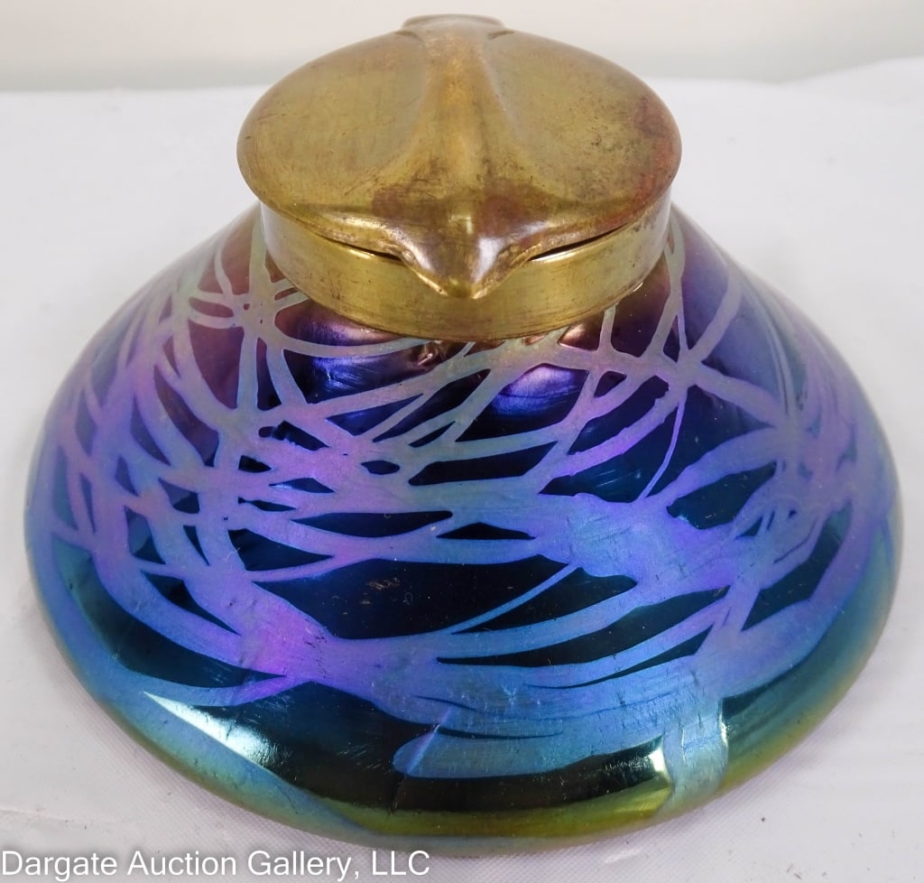 ART NOUVEAU GLASS INK WELL KRALIK LOETZ: Very nice Loetz art glass ink well Art Nouveau style Kralik Loetz. Brass lid marked underneath. / Measures: 2.25"H x 4" diam. / Provenance: From the descendants of Lollie Oliver, Pittsburgh, PA / Cond
