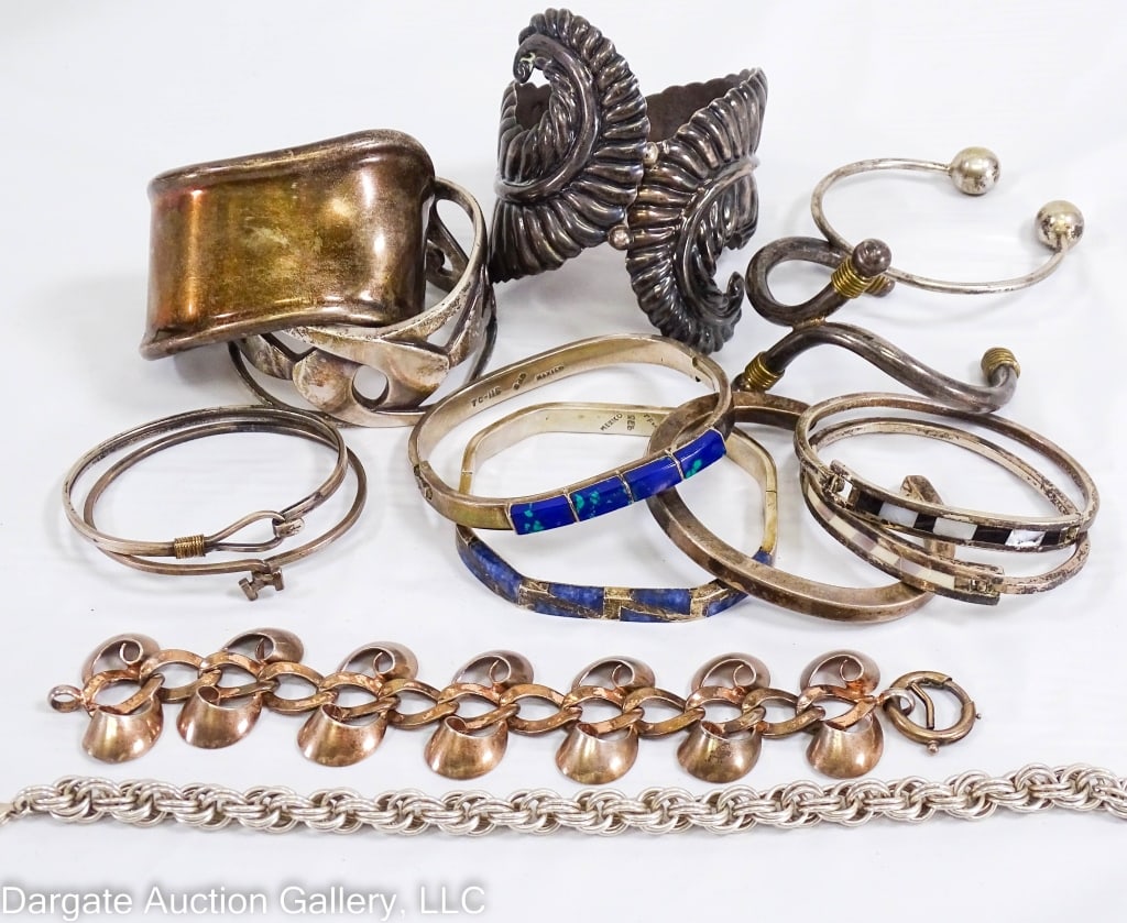 14 MEXICO STERLING BRACELETS: Includes: Leaf design hinged cuff, 2.5?W, has Mexican Sterling marks / 2.25? Cuff [TO-40 MEXICO 925] / 2.25? openwork cuff [925 WM] / 2.5? Bypass cuff [TO-02 HECHO EN MEXICO 925] / (2) 2.25? hooked ba