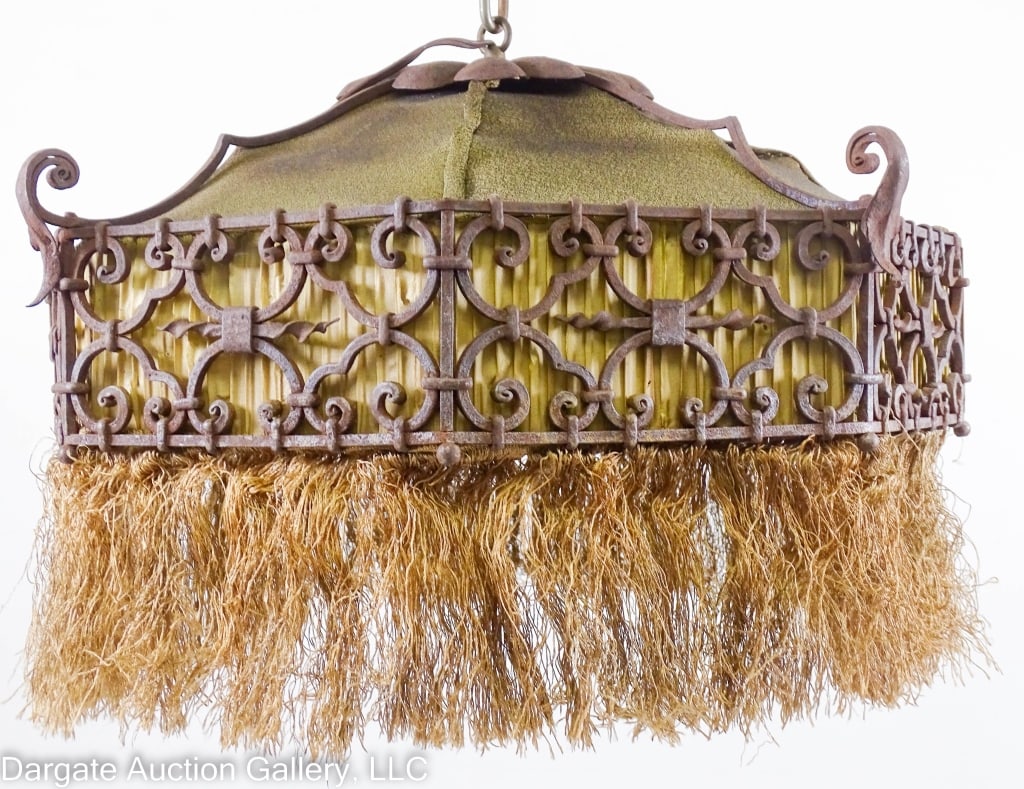 HANDMADE SPANISH REVIVAL WROUGHT IRON CHANDELIER: Wrought iron Spanish revival chandelier with a fitted fabric shade with fringe trim / Measures: 10"H x 22" diameter / Condition: Need rewired, fabric dirty, needs a very deep cleaning