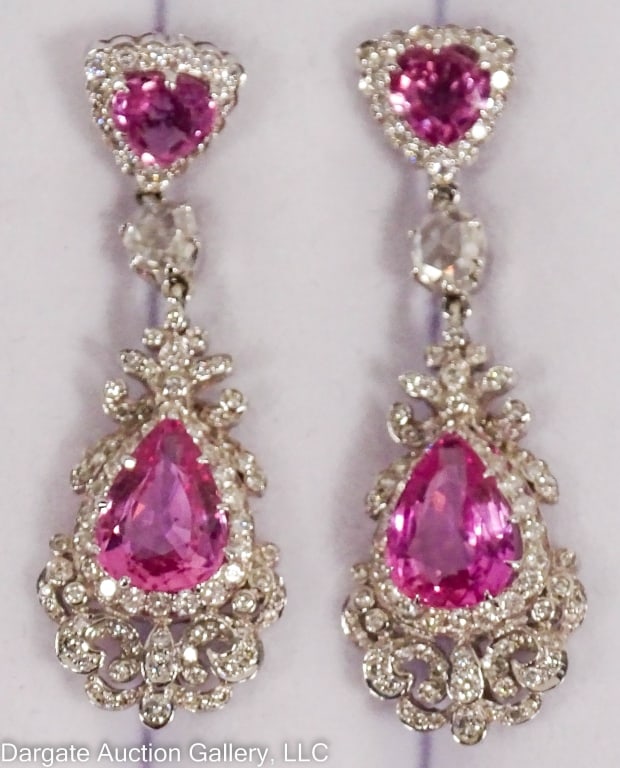 18k GOLD DIAMOND TOPAZ & PINK SAPPHIRE EARRINGS: 18k white gold drop style earrings set with: Topaz (trillion cut) 5.88mm, Pink Sapphire (tear drop) 10.3mm x 7.4mm, Diamonds - small diamonds in a curled vine design / Marked "18k / 750" / Weight: 11.