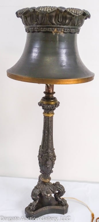 CAST BRITANIA METAL & BRASS GAS ELECTRIFIED LAMP: Fancy cast Briania metal & brass gas table/desk lamp that has been electrified. Fancy paw feet and original Britania metal shade. Extremely heavy. / Measures: Base - 17"H x 5.5"W x 5.5"D ; Lamp - 27"H
