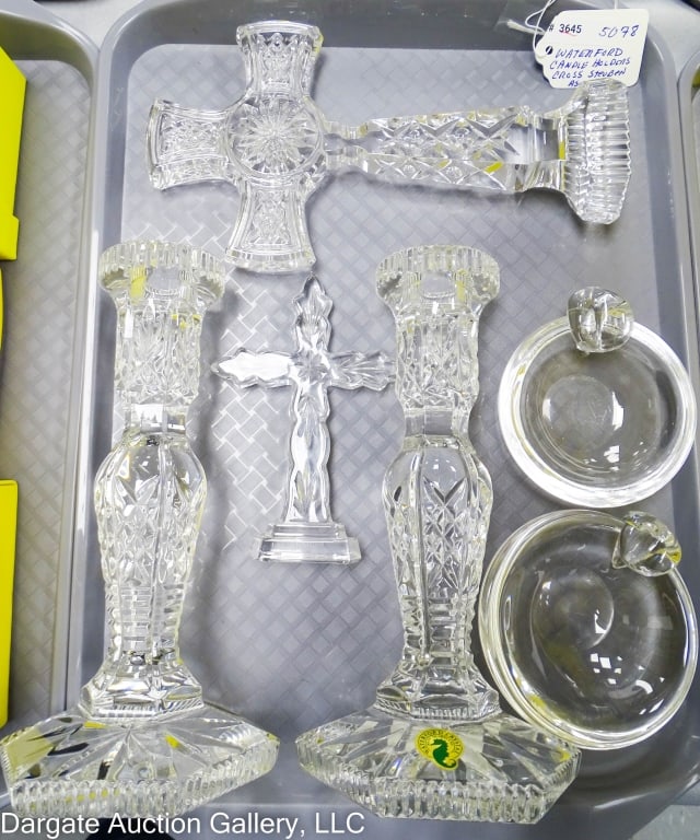WATERFORD CANDLEHOLDERS, CROSS, STEUBEN ASHTRAYS: Pair of Waterford hardwick candle holders signed original foil tags. Signed Kilree Waterford cross & a small signed Waterford cross. Also 2 signed Steuben ash trays. Hardwick candle holders are 4.25" 
