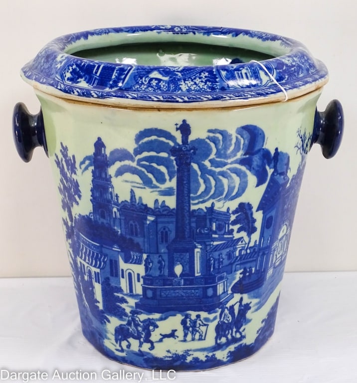 20th CEN. FLOW BLUE IRONSTONE FRUIT CHILLER: Large, two-piece Flow Blue transfer ironstone fruit chiller. 20th century England Victoria Ware. Bucket style base with bowl insert with holes. Dark blue colors. / Measures: 11.5"Hx10"top diam.x'7.5"b