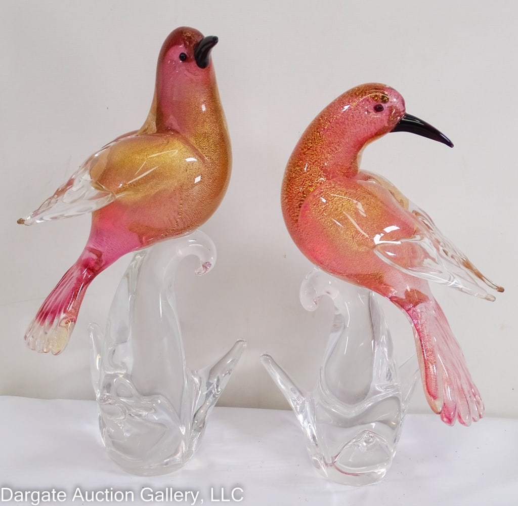 PAIR MURANO GLASS BIRDS PINK W/GOLD FLECKS ITALY: Nice pair of Murano glass birds on clear glass tree base. Birds are pink glass with gold flecks throughout body and tail. Clear glass wings. Black beaks and eyes. / Measures: 10" & 11"H x 4.5"W x 5" D