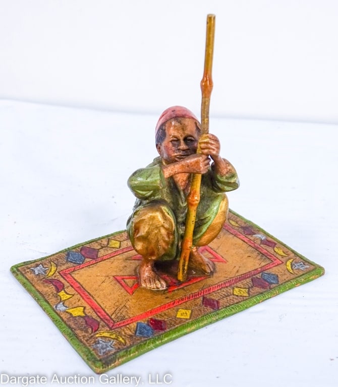 CABINET BRONZE BERGMAN STYLE BOY ON RUG AUSTRIA: Nice looking cabinet bronze in Bergman style. Young Middle Eastern boy with rod squatting on a Persian rug. Bronze nicely cold painted marked Austria. / Measures: 3.25"H x 2.25" W x 3.25" L / Provenan