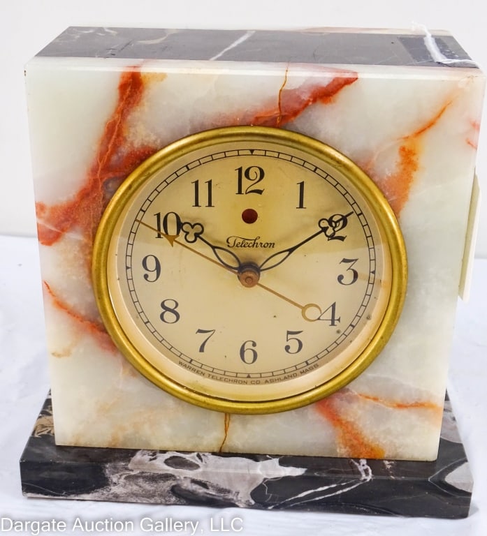 ART DECO WARREN TELECHRON MARBLE CASED CLOCK: Warren Telechron Art Deco style marble cased clock. Two-toned marble model M-1 Serial # 297633A. Brass bezel. Has been rewired. Working condition, running. / Measures: 7.5" H x 4.75" w x 7.75 L / Prov