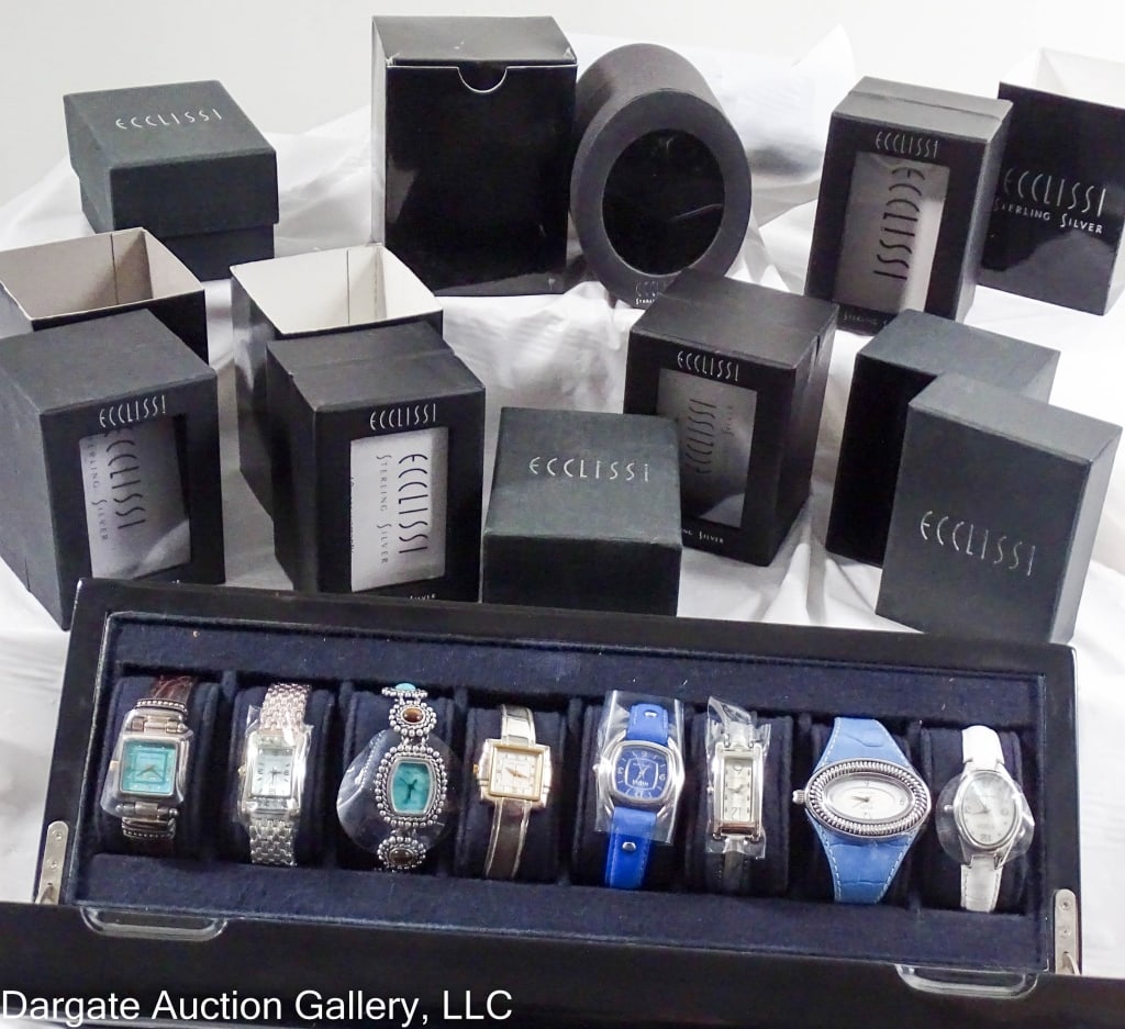 8 ECCILISSI STERLING WATCHES BOXES & DISPLAY CASE: All watches have Sterling Silver case with Stainless Steel Backs and Quartz Movements. Each watch has an original box. Also included is an 8 watch display case / Watch Models include: No 22690 White M