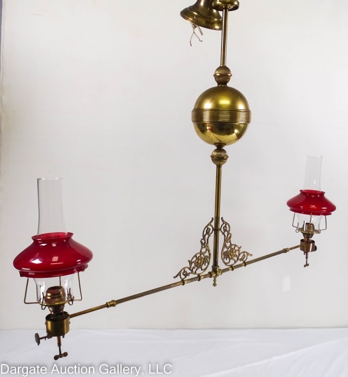 PAIR DOUBLE-LIGHT GASOLIER PENDANT LIGHT FIXTURES: c1890's / Antique double-light pendant gasolier ceiling light fixtures made of solid brass with red glass shades and chimneys. Has original gas knobs, but has been completely restored and electrified.