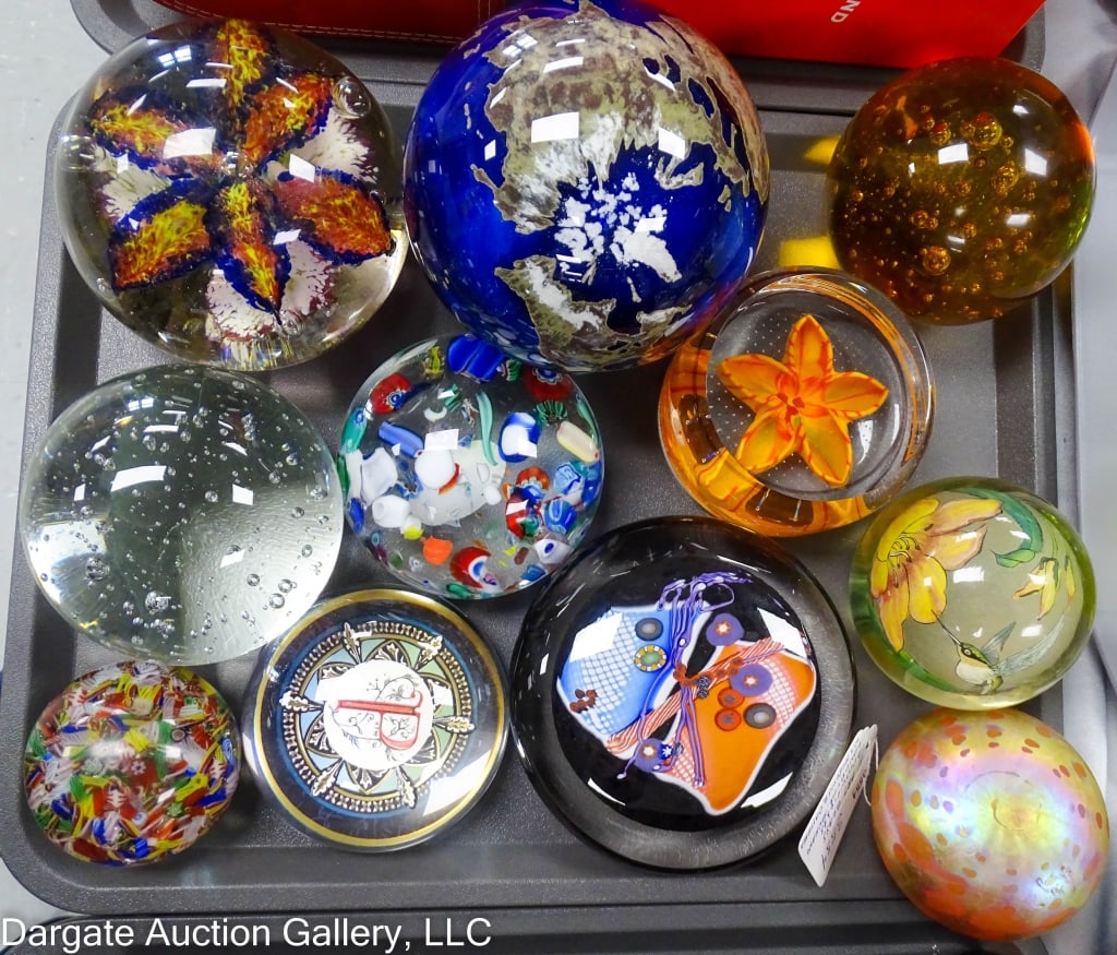 11 PAPERWEIGHTS, LUNDBERG WORLD SPHERE, CAITHNES: 11 art glass paperweights. Lundberg Studios World Sphere, Caithnes Scotland flaming beauty, W.S. Horowitz, Murano scrambled cane controlled bubble. Sizes range from 2.5" to 5" diameter and 1.5" to 4.5