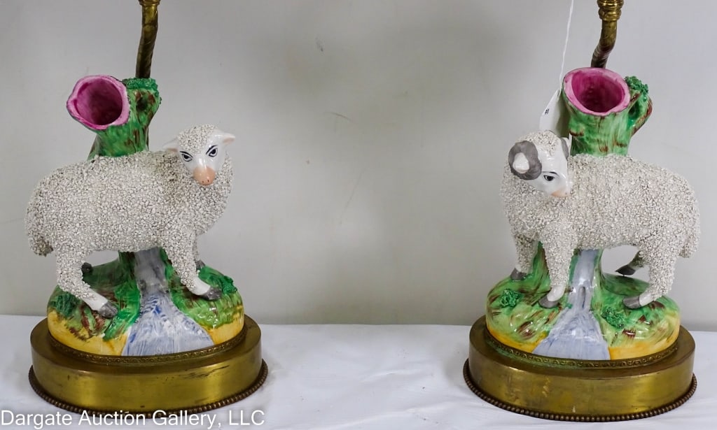 PAIR OF STAFFORDSHIRE SHEEP SPILL VASE LAMPS: Pair of English porcelain Staffordshire spill vases depicting and ewe and a ram, right and left facing to face each other converted into lamps with oval silk shades / Measures: Vase - 7.25"H x 5.25"W