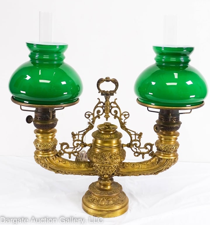 HARVARD VICTORIAN BRONZE DOUBLE STUDENT LAMP FANCY: large heavy bronze double student lamp with green case glass shades marked Harvard on burner knobs. This has been drilled for electrical but have what appears to be the original burners that have not