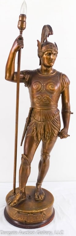 SPELTER STATUE OF ETRUSCAN WARRIOR SOLDIER: Large lighted Etruscan warrior-soldier spelter statue. The figure is made of spelter with a bronze finish. The figure stands on a brass and wooden base holding a spear that is the light. This has very