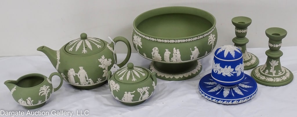 7pcs OF WEDGEWOOD W/ JASPERWARE CONSOLE/TEA SET: Green Jasperware tea set; 3 piece green Jasperware console set; and a blue Jasperware match holder with striker. Marked [Wedgewood Made in England] / Measures: 5.25" H x9" W / Provenance: From the des