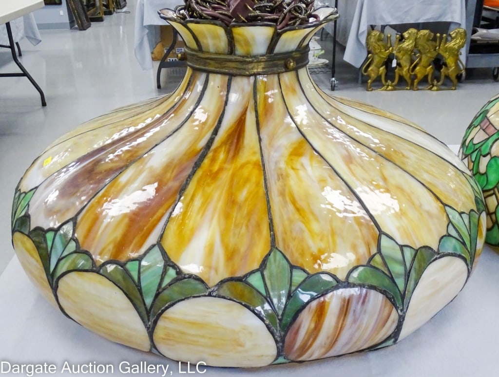 LARGE LEADED GLASS HANGING LIGHT SHADE: Nice large leaded glass hanging ceiling light and shade. Caramel white bent panels with caramel bullseyes and multi shades of green. 25" diameter. / Measures: 12.75"H