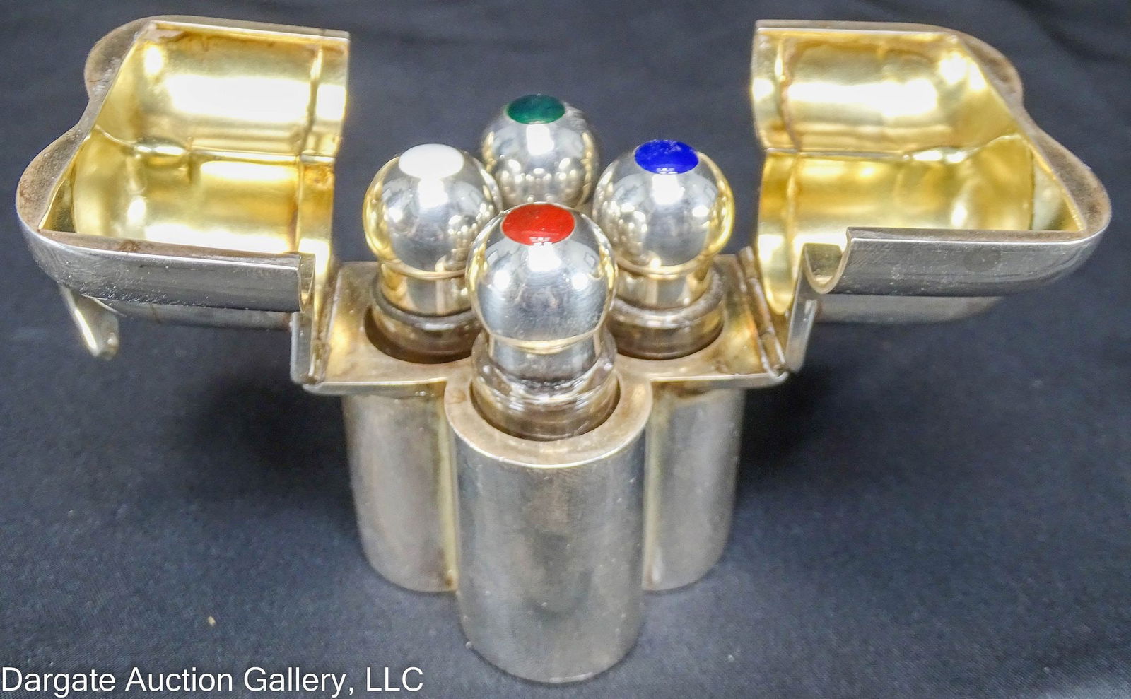 ENGLISH STERLING TRAVELING PERFUME CASE w/ BOTTLES: An English Sterling traveling perfume holder, with the four original glass bottles, enamelled silver lids; hallmarked [William Edward Hurcomb, Sterling, London, 1904] gold washed interior hinged top /