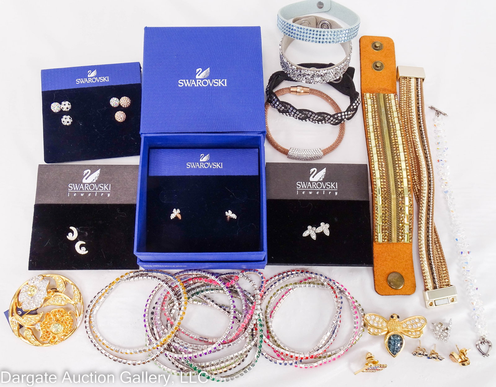 30+pc SWAROVSKI AND RELATED JEWELRY LOT: Includes: (9) Pairs Swarovski earrings – (1) has original box, (6) on Swarovski earring holders (All 7 marked on post), (1) loose marked on back of earring, (2) loose and not marked; (2) Brooches ��