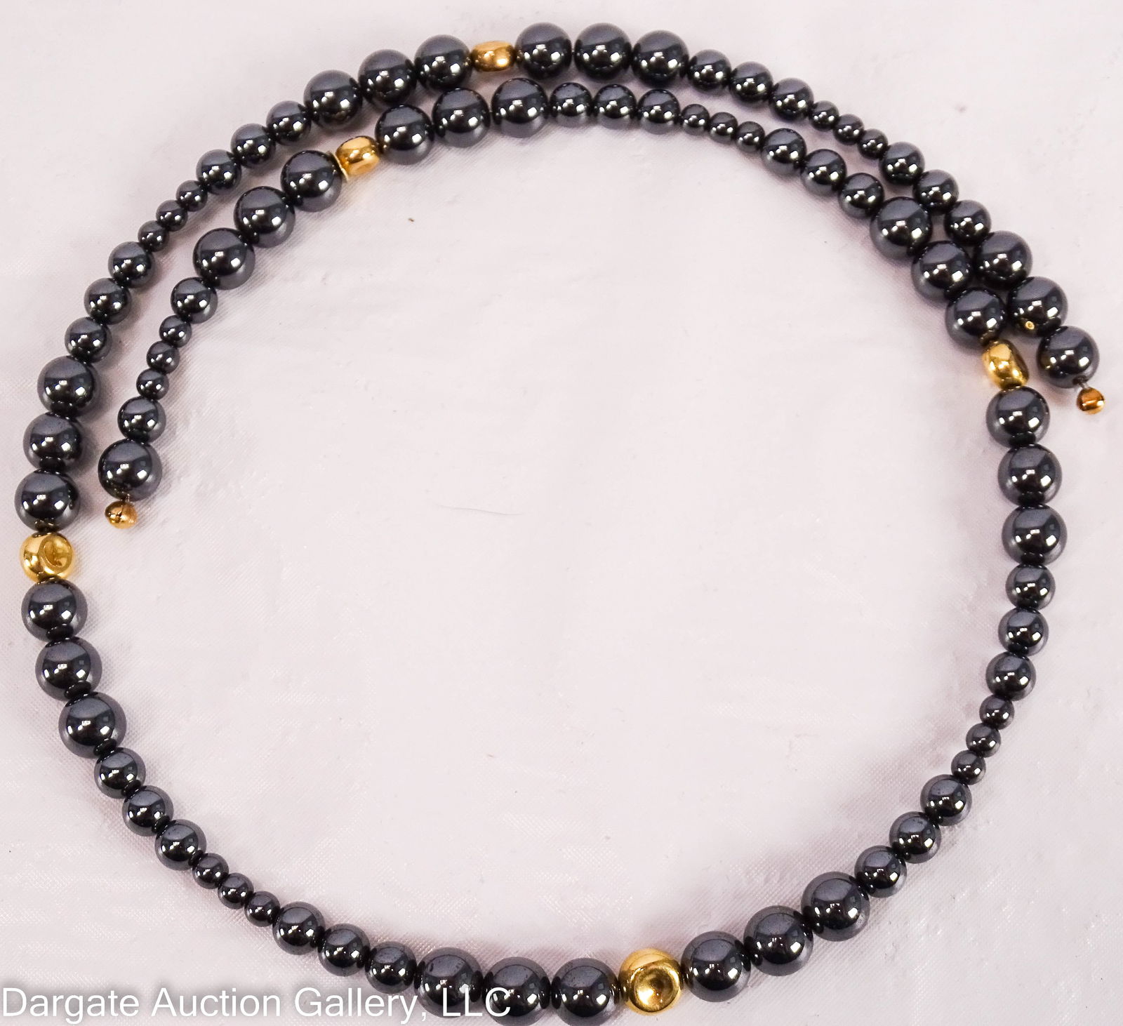 RLM STUDIO HEMATIT AND 14K CHOKER NECKLACE: Robert Lee Morris Studio Choker necklace - Hematite beads in graduated sizes with 14k yellow gold spacers. One of the hematite beads is marked [RLM STUDIO CHINA 14K] / Weight: 75.3g / Provenance: From