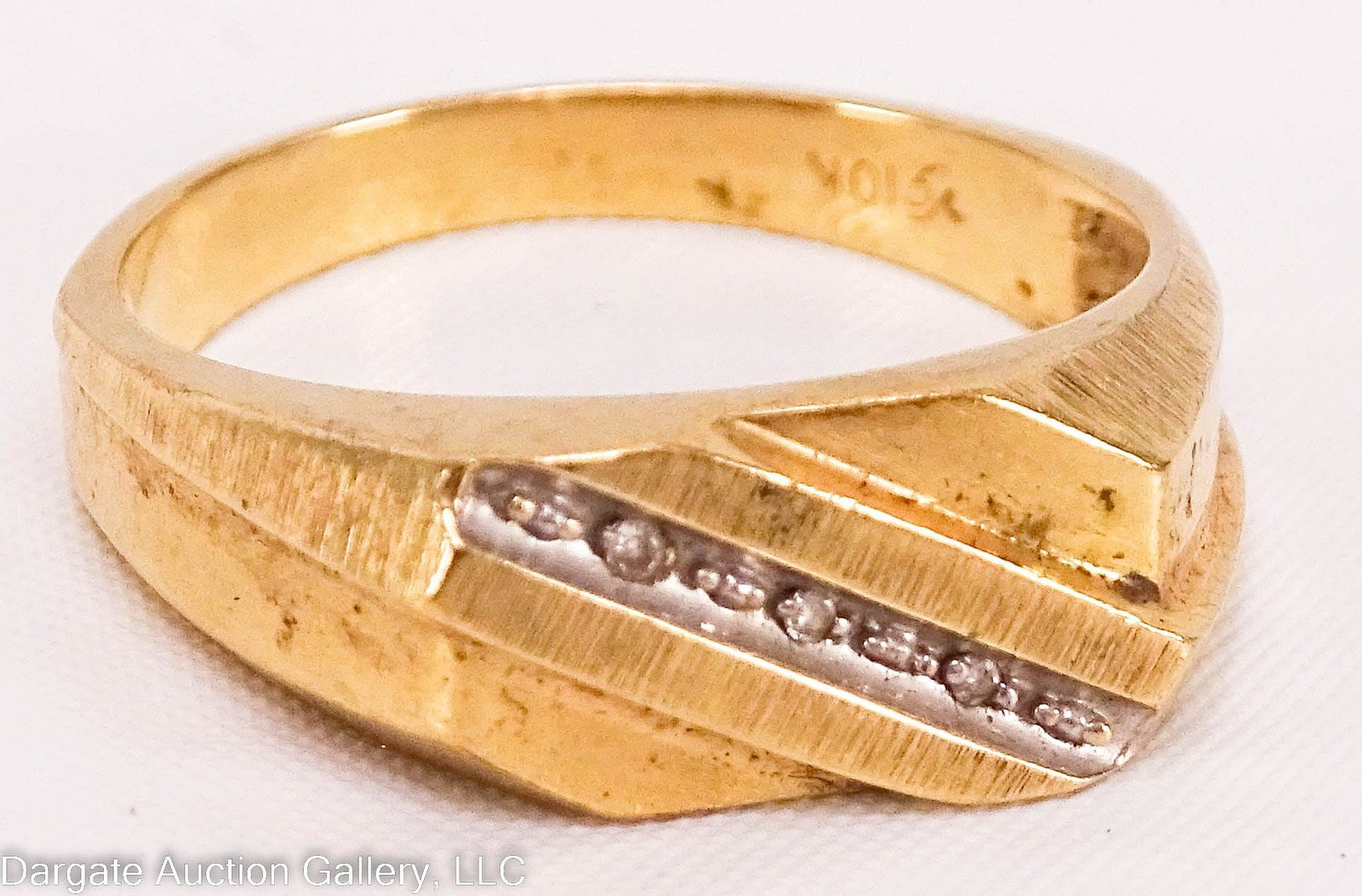 10k YELLOW GOLD MEN'S DIAGONAL BAND RING: 10k yellow gold men's ring with a flat top and a diagonal design set with 3 small diamonds; Marked [Vg 10K] / Weight: Total Gross Weight: 3.6g / Measurements: Size 10.5 / ONLINE PAY MSG ****SEE TE