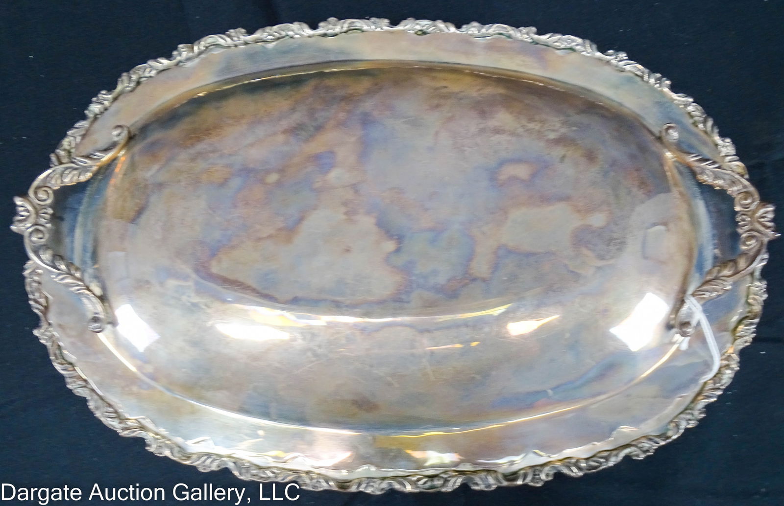 MEXICAN STERLING COVERED SERVING DISH: A covered serving dish with a scrolled edge, marked [Sterling 925 MRR MEXICO]; Lid is designed to be turned over and used as an extra serving piece when needed / Weight: 37.44ozt / Measurements: 2.25"