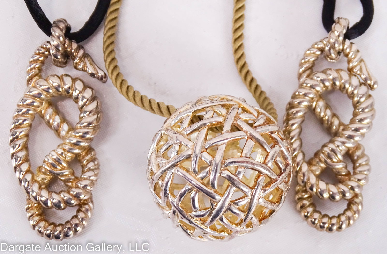 3 ANGELA CUMMINGS STERLING PENDANT NECKLACES: Includes: (2) 35" black velvet cord necklace with sterling slides for adjustable length with Sterling twisted knot rope pendant [AC STUDIO 925 THAILAND]; (1) 22" Tan silk cord with open-work sterling