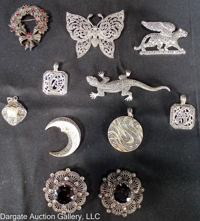 11 PIECES MARCASITE & STERLING PENDANTS & BROOCHES: ALL MARKED [925]. Pendants include: 1.5” round swirl pendant with abalone or mother of pearl backing; 1” square “S” enhancer; 1” square “C” enhancer; 1”L pearl