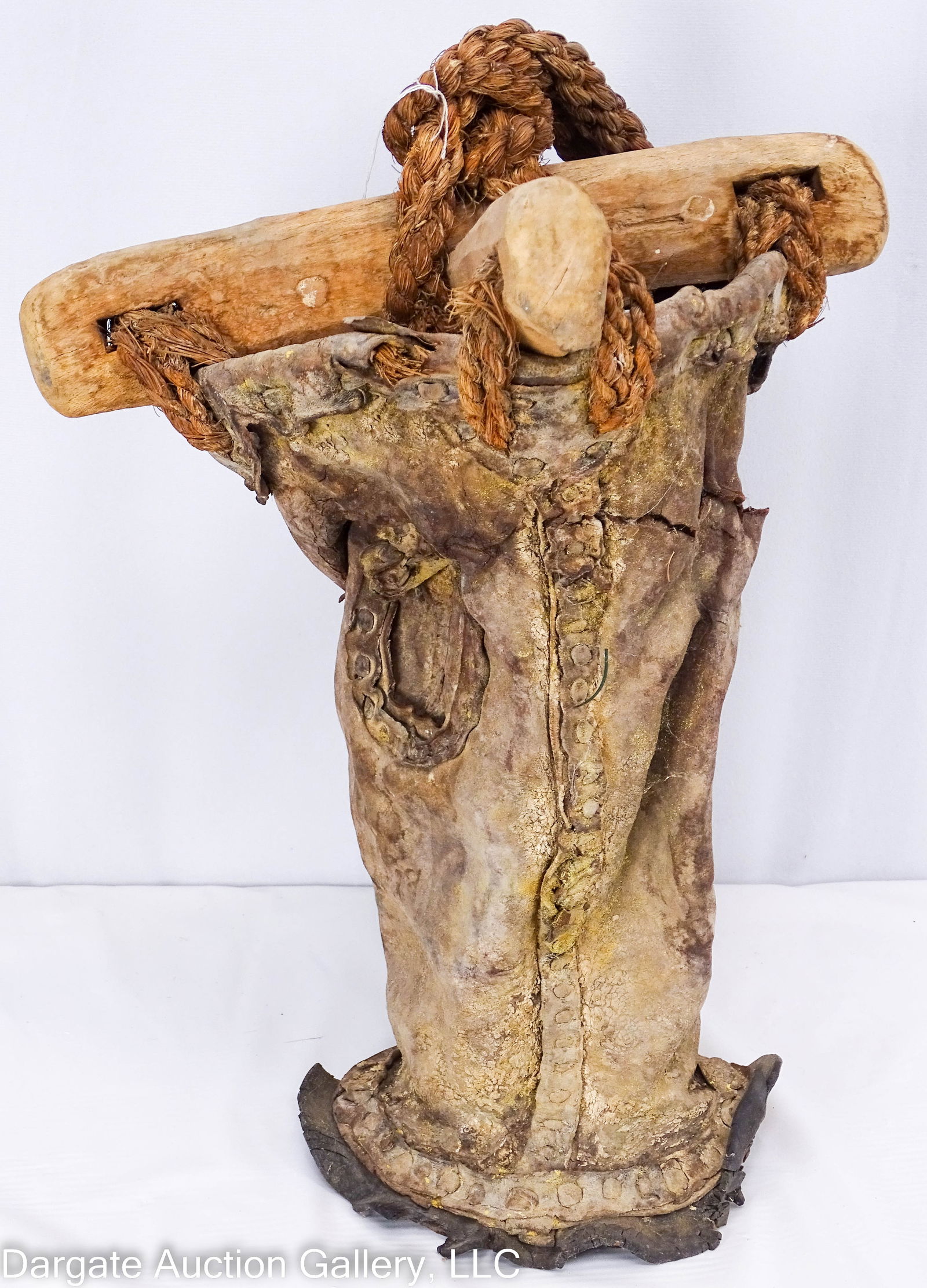 LEATHER WELL BUCKET DISCOVERED IN SAUDI ARABIA: A leather bucket discovered in the Saudi Desert, made with a wooden cross braces and rope from use in a well. Bucket shows old repairs, and the leather is desiccated with areas of loss and cracking. E