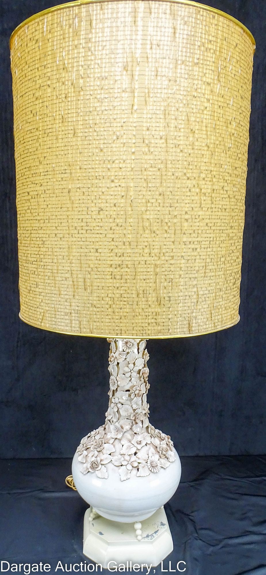 MARBRO STYLE WHITE CAPODIMONTE MCM LAMP: A Mid-Century Modern Marbro style table lamp raised on a metal base with its original brass and fiberglass drum shade; made in Italy / Measures: 43"H with shade, 19" shade diam / Condition: 5 chips to