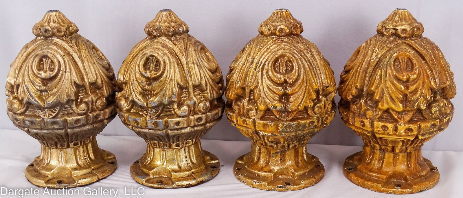 4 CAST ALUMINUM POST FINIALS: 4 Cast aluminum post finials with an antique gold finish / Measures: 7.5"H, 4.25" diameter base