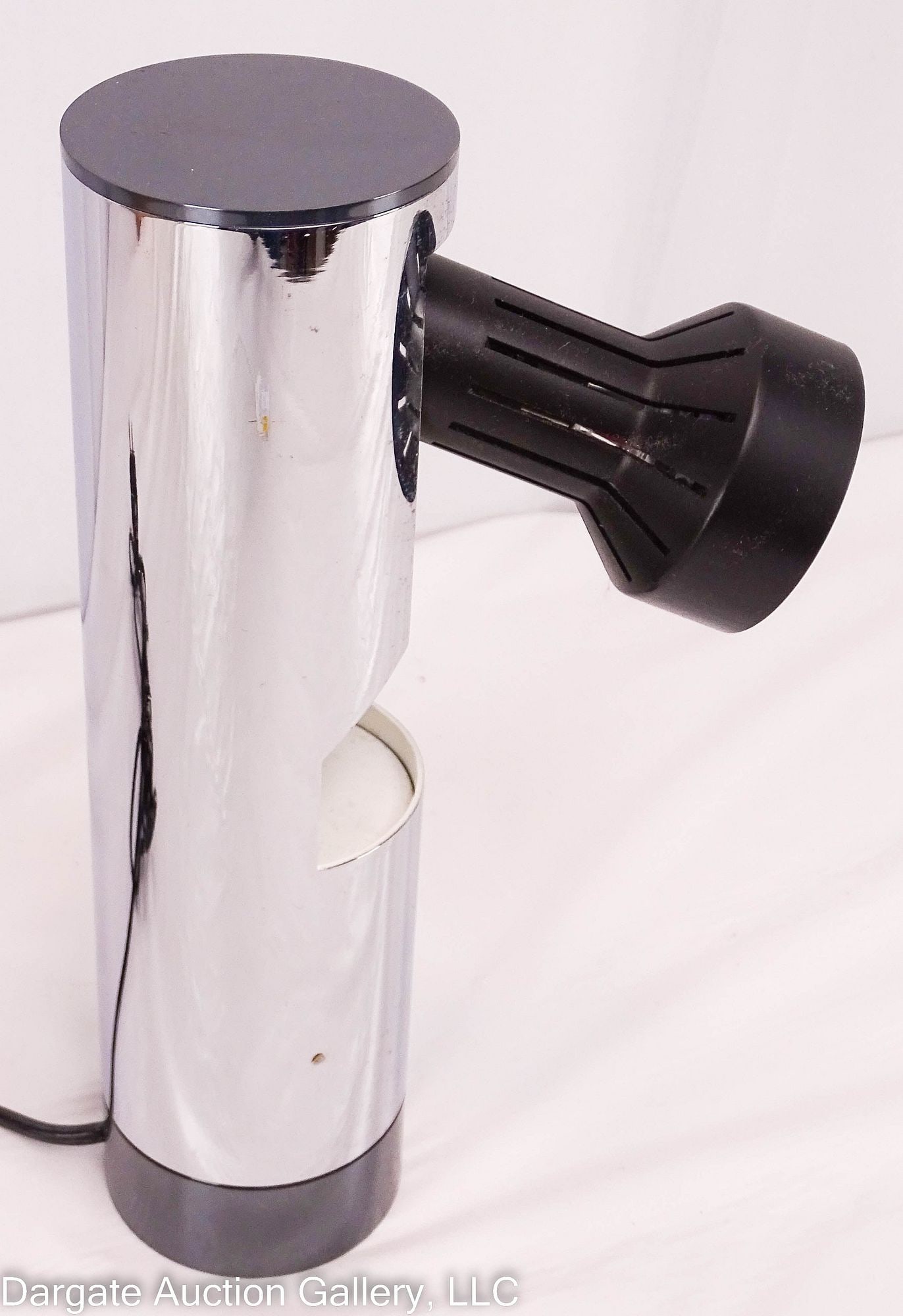 MCM ANGELO LELLI ARREDOLUCE TABLE LAMP: Mid-Century Modern / Circa 1960's / Steel cylindrical form base, light source pivots out and folds back inside body of lamp / Measures: 9.75"H x 2.5" diameter / Condition: working condition unknown -