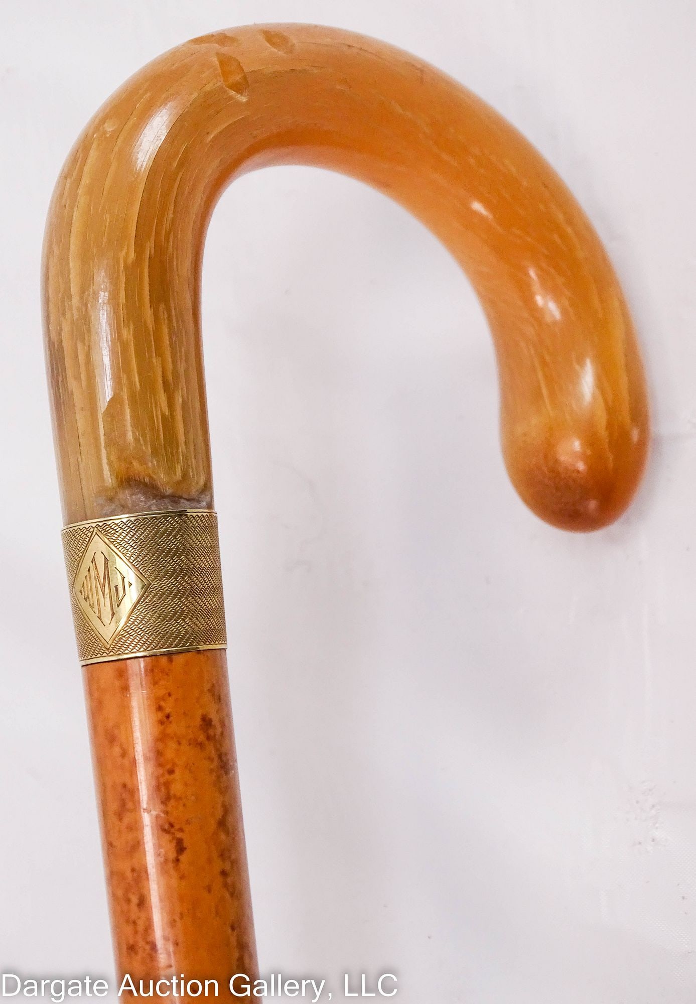BAMBOO CANE 14K COW HORN HANDLE: Collar of handle is a band of 14k yellow gold, cow horn handle and tip. / Measures: 36" / Provenance: From the descendants of Lollie Oliver, Pittsburgh, PA / Condition: Cow horn handle has pieces miss