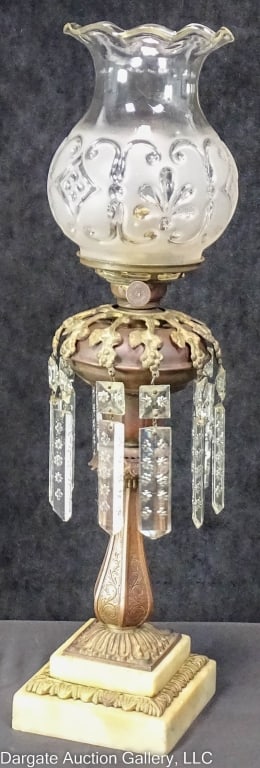 19TH CEN DIETZ BANQUET LAMP RISING ASTRAL SHADE: Prism ring w/ floral cut colonial prisms. Period astral type shade. The lamp has a brass font and column with a tiered marble base. Burner knob marked [Crystal Light Pat Apr 26, 1870; Sept. 19, 1871;