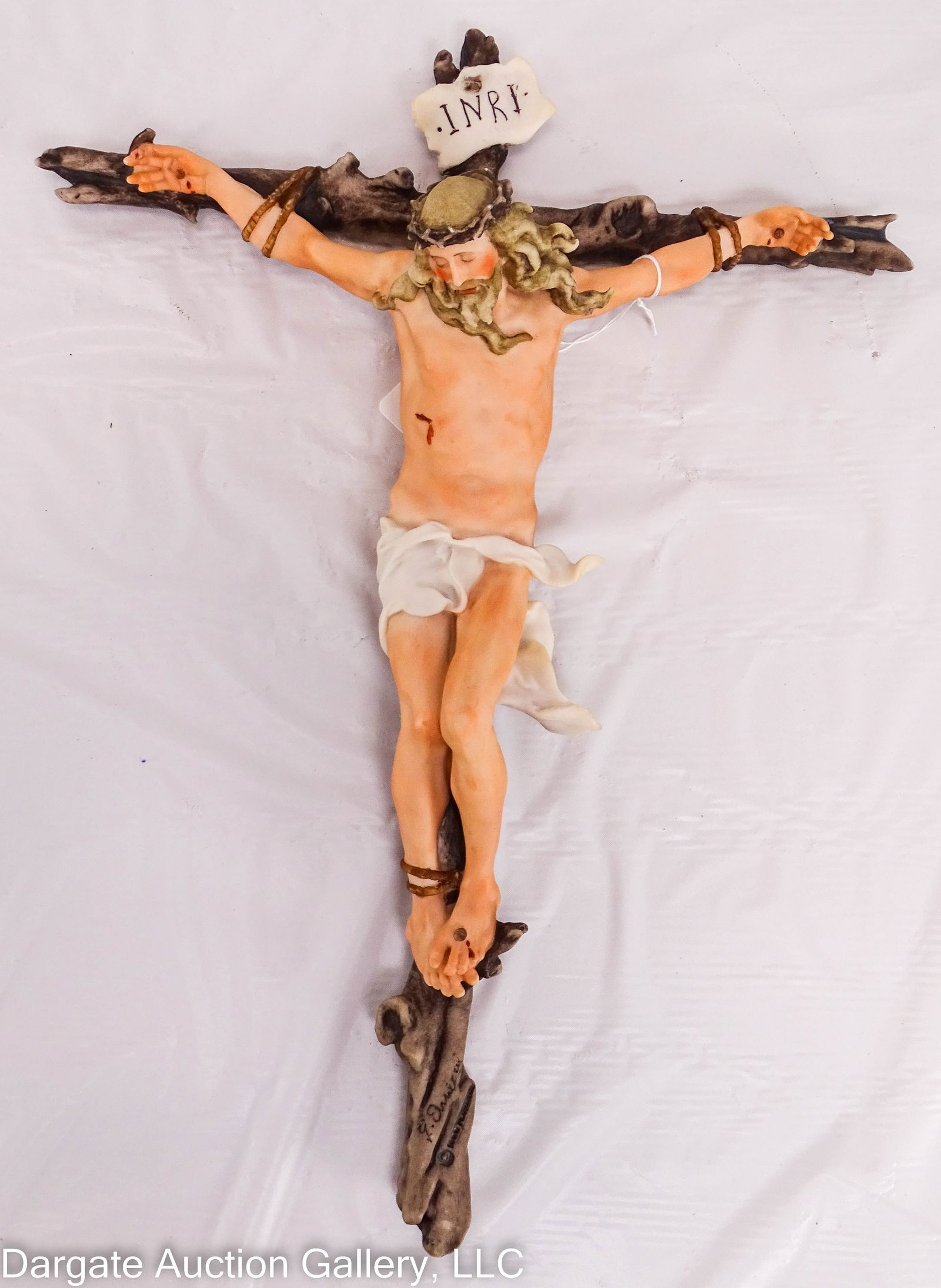 CAPODIMONTE PORCELAIN PASSION OF CHRIST CRUCIFIX: Circa 1980 matte glazed Capodimonte porcelain crucifix, marked on bottom front [G ARMANI 1980 FLORENCE], reverse has the Capodimonte logo / Measures: 16.5"H x 12"W x 4"D / Condition: No chips, cracks