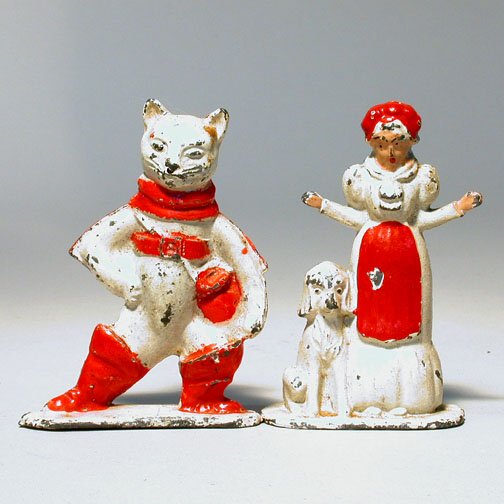 TWO VINTAGE LEAD TOMMY FAIRYTALES.: Puss in Boots and Old Mother Hubbard and her boneless dog c. 1940. Paint chips and overall wear. 3"h each