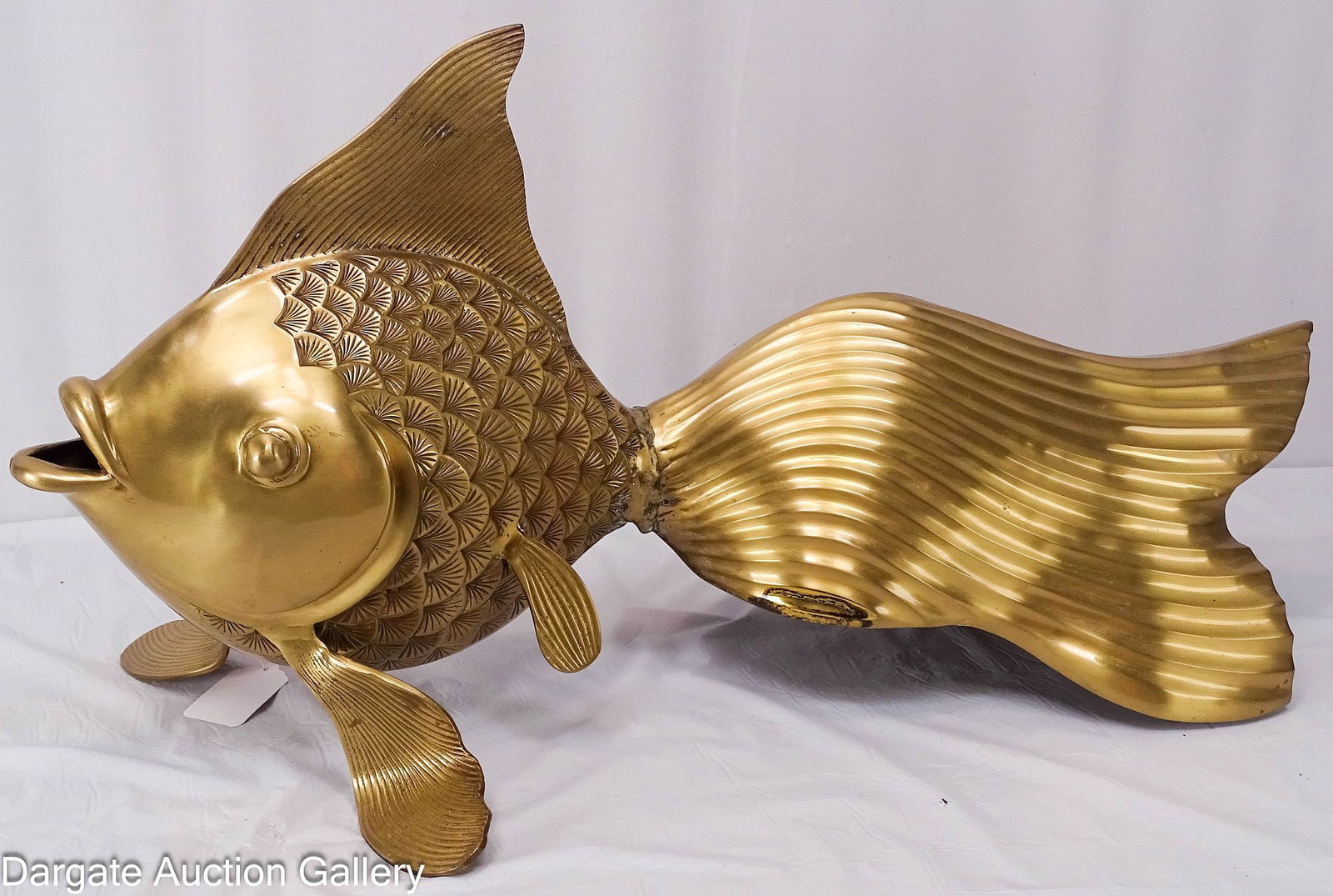 LARGE WILDWOOD BRASS FISH SCULPTURE: A large brass goldfish sculpture, labeled on the bottom [Wildwood Made in India], Heavy for its size; Measures: 14"H x 27"W x 14"D; Condition: Scratches and discoloration, some verdigri