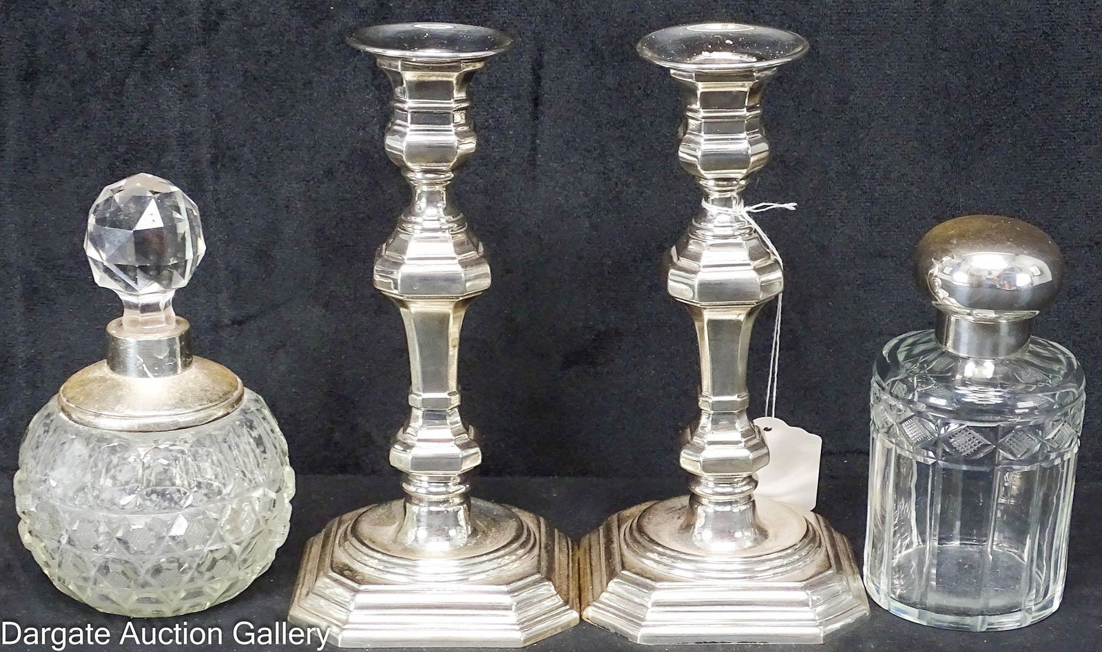 (4) SILVER TABLE ARTICLES INCL STERLING: Includes: A pair of Georgian style candlesticks, both with European hallmarks, one marked [STERLING 925], bottoms appear to be steel 7.75"H x 3.75"W x 3.75"D A cut glass perfume b