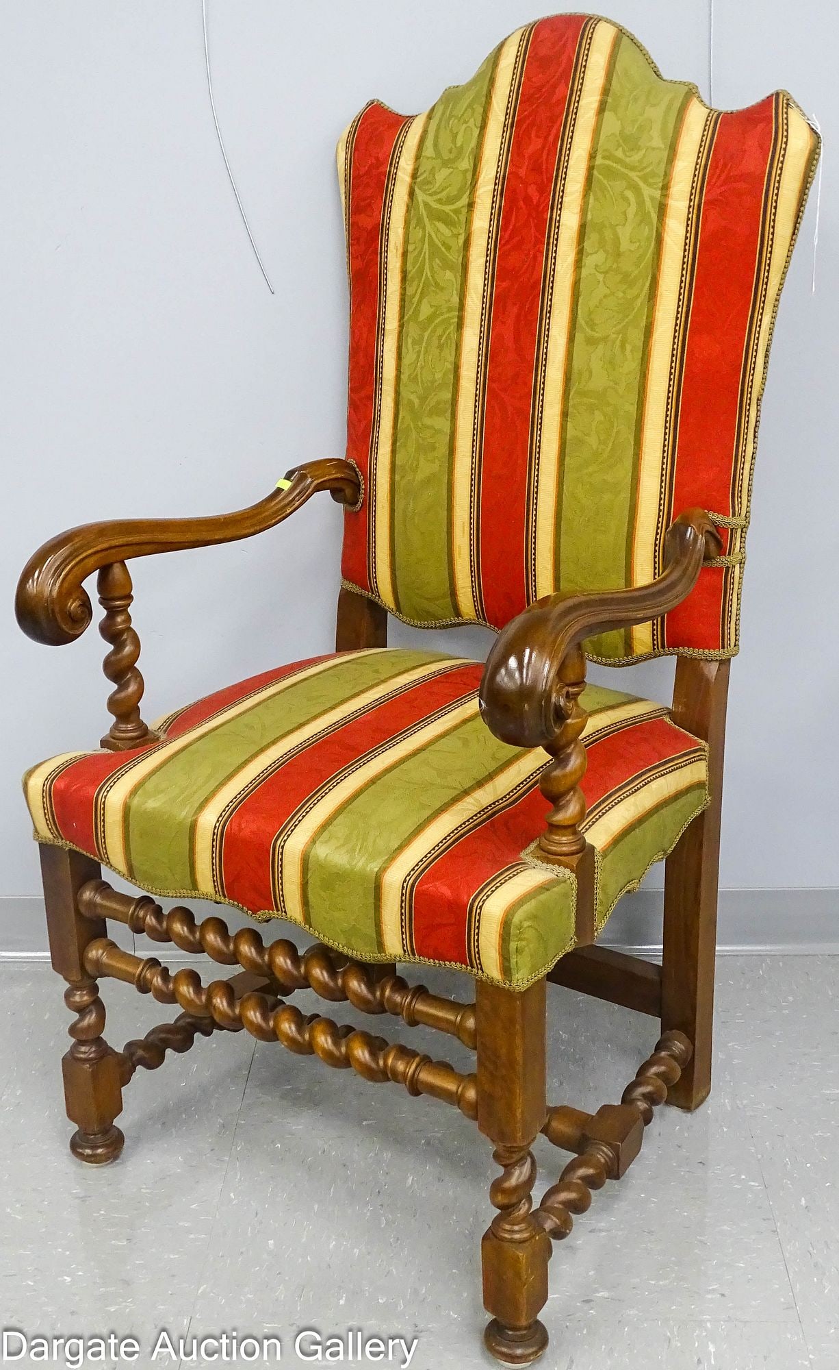TRANSITIONAL LOUIS XIII TO LOUIS XIV STYLE ARM CHAIR: An armchair in a Louis XIII to Louis XIV transitional style, in a red, green and gold striped upholstery, turned legs and barley twist stretchers; Measures: 48.5"H x 25"W x 21"D; Condit