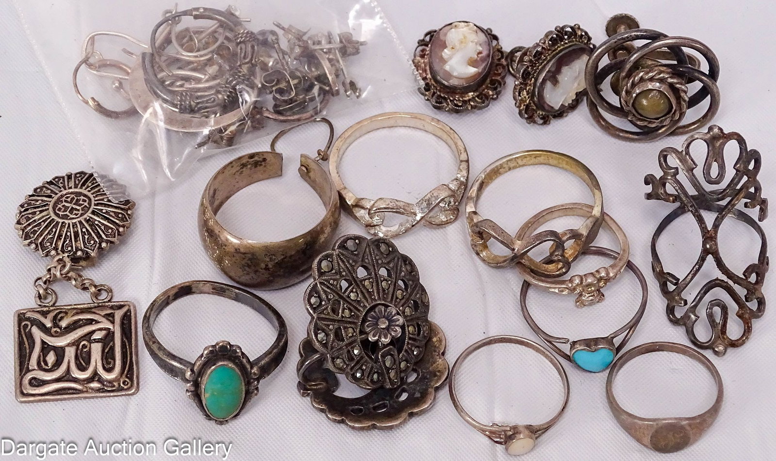 ASSORTED RING AND EARRING LOT incl STERLING: This is a mismatched lot of (8) rings and earrings. Most of the earrings do not have a match, many of the pieces are marked Sterling; All pieces have condition and need cleaned; Total Gross Weight - 4