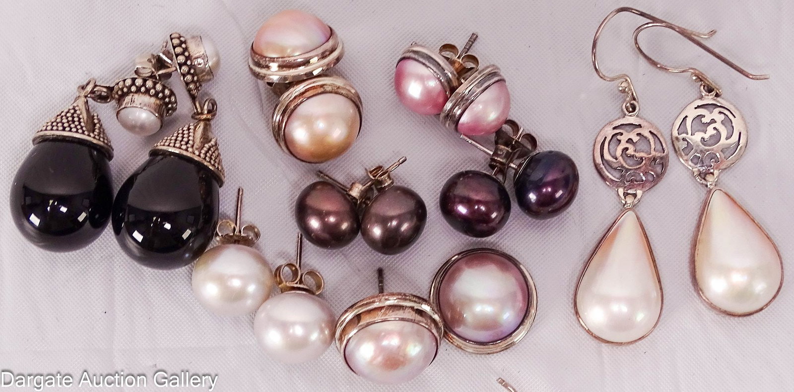8pc STERLING AND PEARL PIERCED EARRINGS: All pierced earrings: (6) pairs - post (one post is broken), (1) dangle with hooked backs (1 is mother of pearl) and (1) dangle with post (small pearl and tear drop onyx); Total Gross Weight - 47.4g