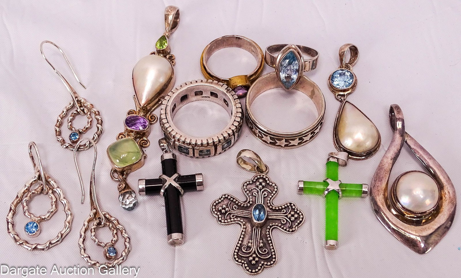 10pc ASSORTED STERLING JEWELRY: Includes: (4) rings Size 6.5 spinel Size 14.5 spinner Size 7.5 two-tone, round amethyst Size 10 spinel 3pc pendant and earring set - tear dropped shaped spinel (3) Cross pendants - onyx,