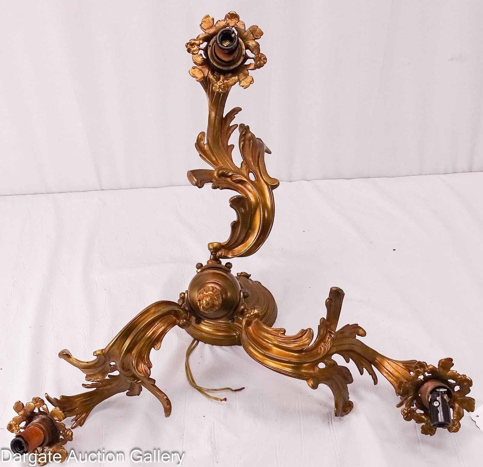 ART NOUVEAU CAST BRASS CHANDELIER: 3-light cast brass ceiling light chandelier; floral leaf with flower blossoms design; Measures - 11"H x 18"D; Condition - One plastic light socket is broken, needs rewired