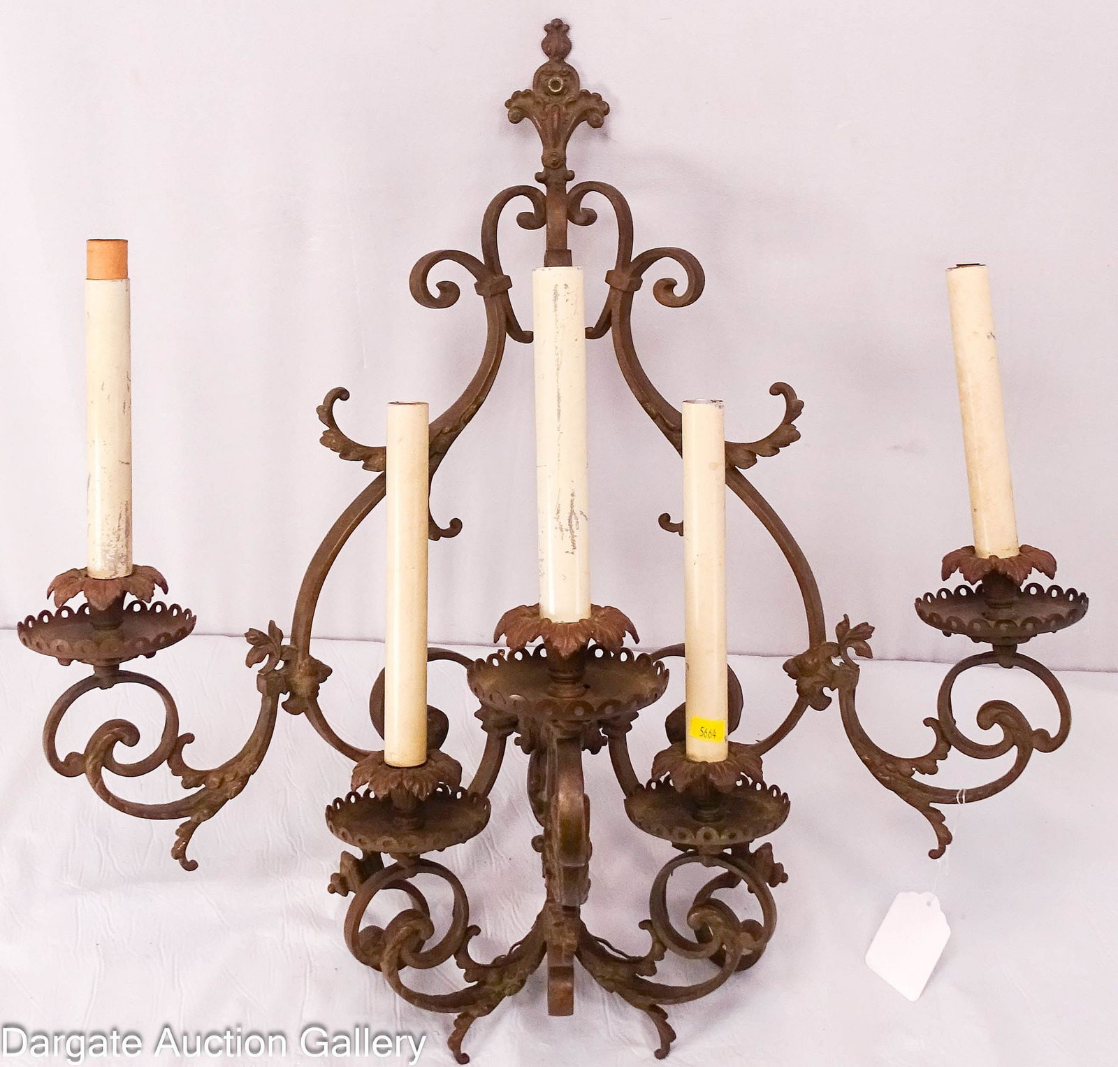 FANCY CAST BRASS WALL SCONCE LOUIS XV: 5-light French Neoclassic style cast brass sconce with nice details; painted tin "candles"; Measures: 23"H x 23"W x 12.5"D; Condition - Soiling and scuffing to tin candles;