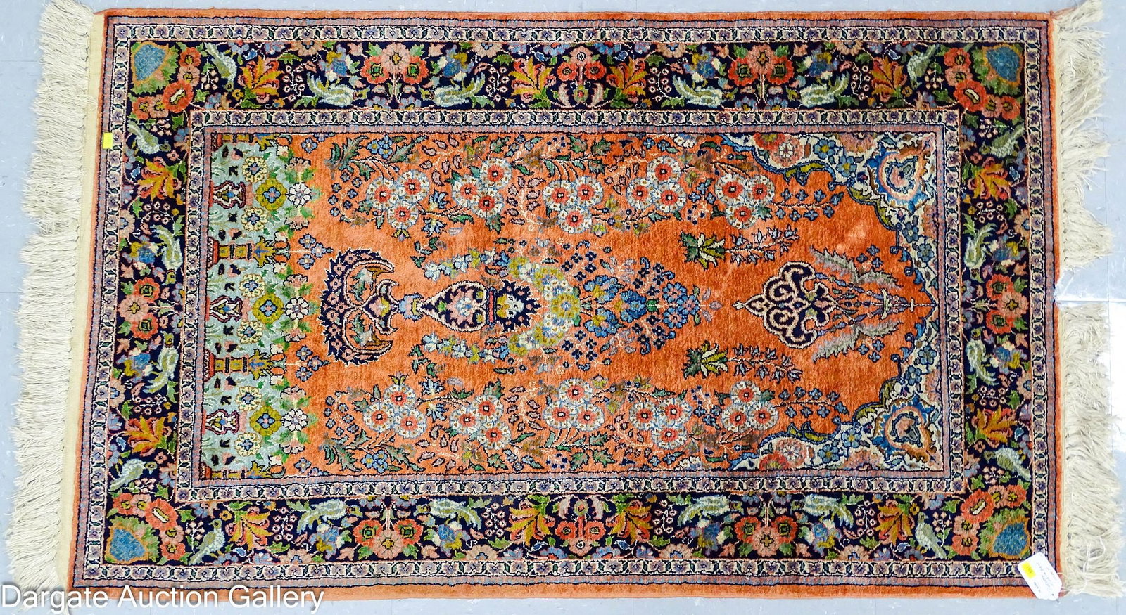 HAND KNOTTED PERSIAN MEHRABAN RUG: An asymmetrically designed floral rug in dark hues of rust, black, green and blue; Measures: 50" x 30"; Condition - Fringe loss, slight wear and fading