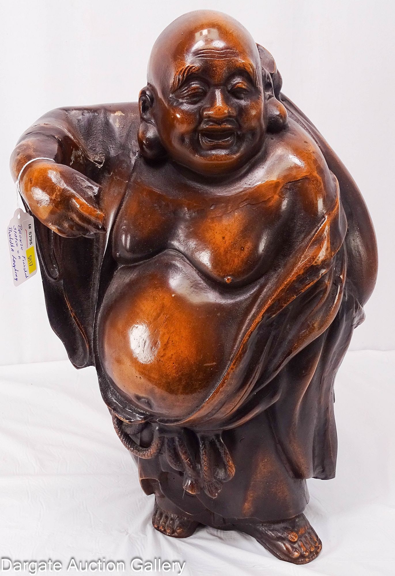 BRONZE FINISHED STATUE OF BUDAI/HOTEI LAUGHING BUDDHA: A cast metal sculpture with a bronze finish of the laughing Buddha; Measures: 21"H x 14"W x 8"D; Condition: Has previously broken and has been repaired. Does not sit flat and wants to f