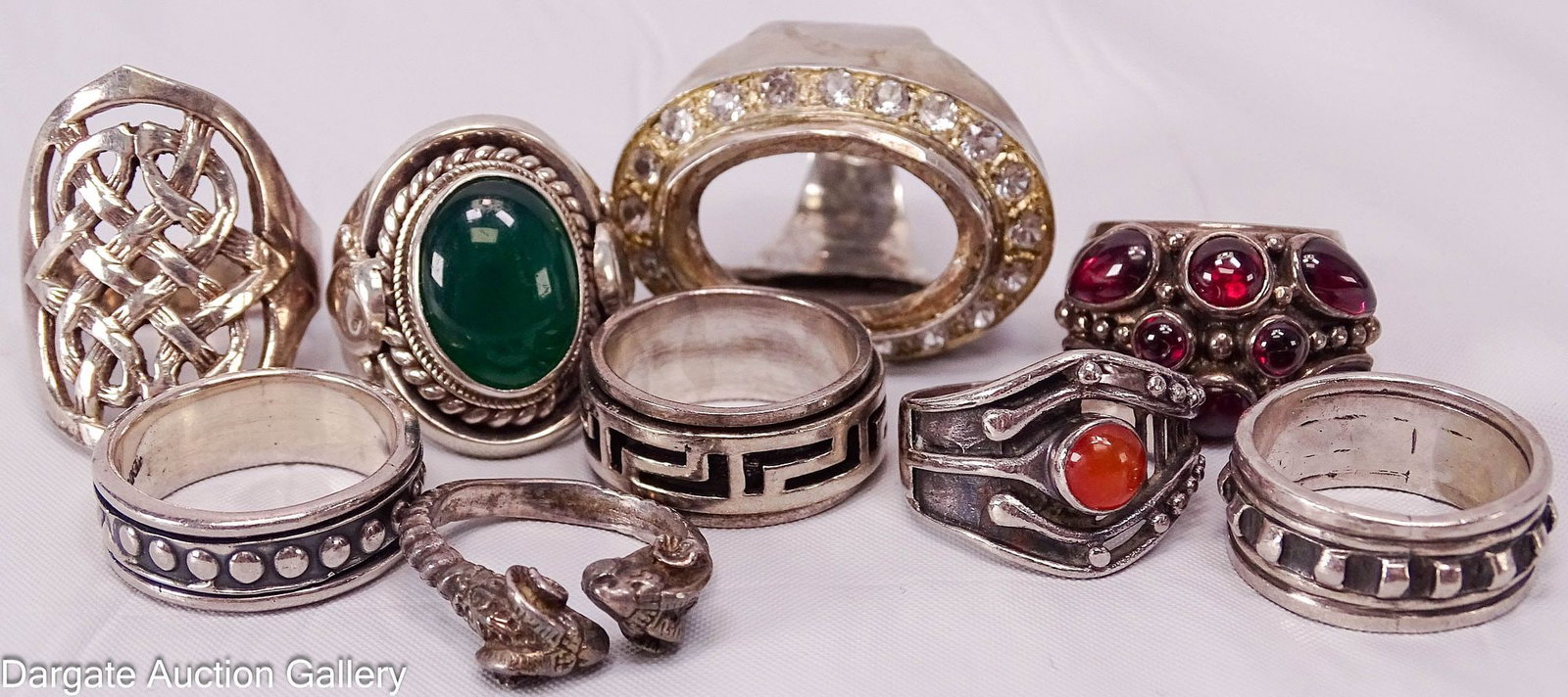 (9) ASSORTED STERLING RINGS: Includes: (1) Celtic knot design, size 10.5 [925]; (1) Beaded design, size 9, [Mexico 925]; (1) Greek design, spinner style, size 7 [925]; (1) dragon head ring, size 6 [mark is worn]; (1) Beaded desig