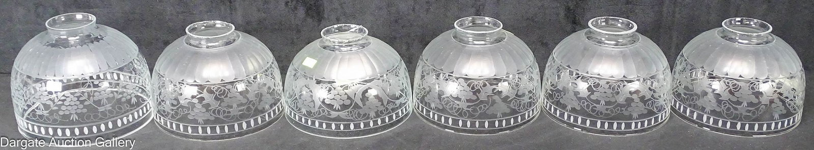 (6) WHEEL ETCHED GAS LIGHT SHADES: Includes: (5) matched grade and leaf wheel etched gas light shades (2.5" fitter, 4.5"H x 6.75" diameter) A single, similarly cut grape and vine wheel etched gas light shade (2.25&