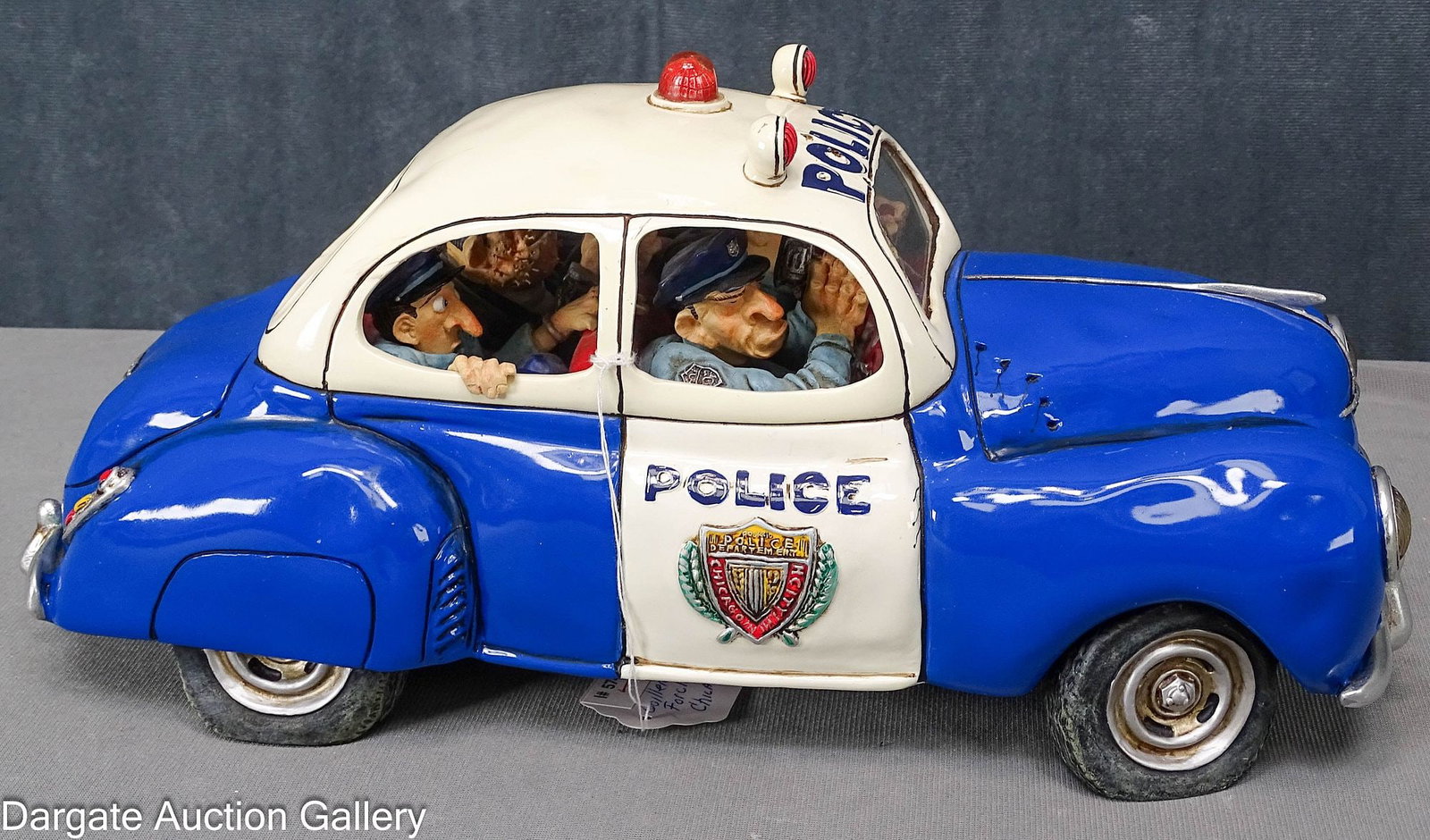 GUILLERMO FORCHINO CHICAGO POLICE CAR: Guillermo Forchino (Argentina, b. 1952) is known for his comic art. This pieced depicts a Chicago Police Car, with two older policeman in front, one shooting through he windshield, and a rookie c
