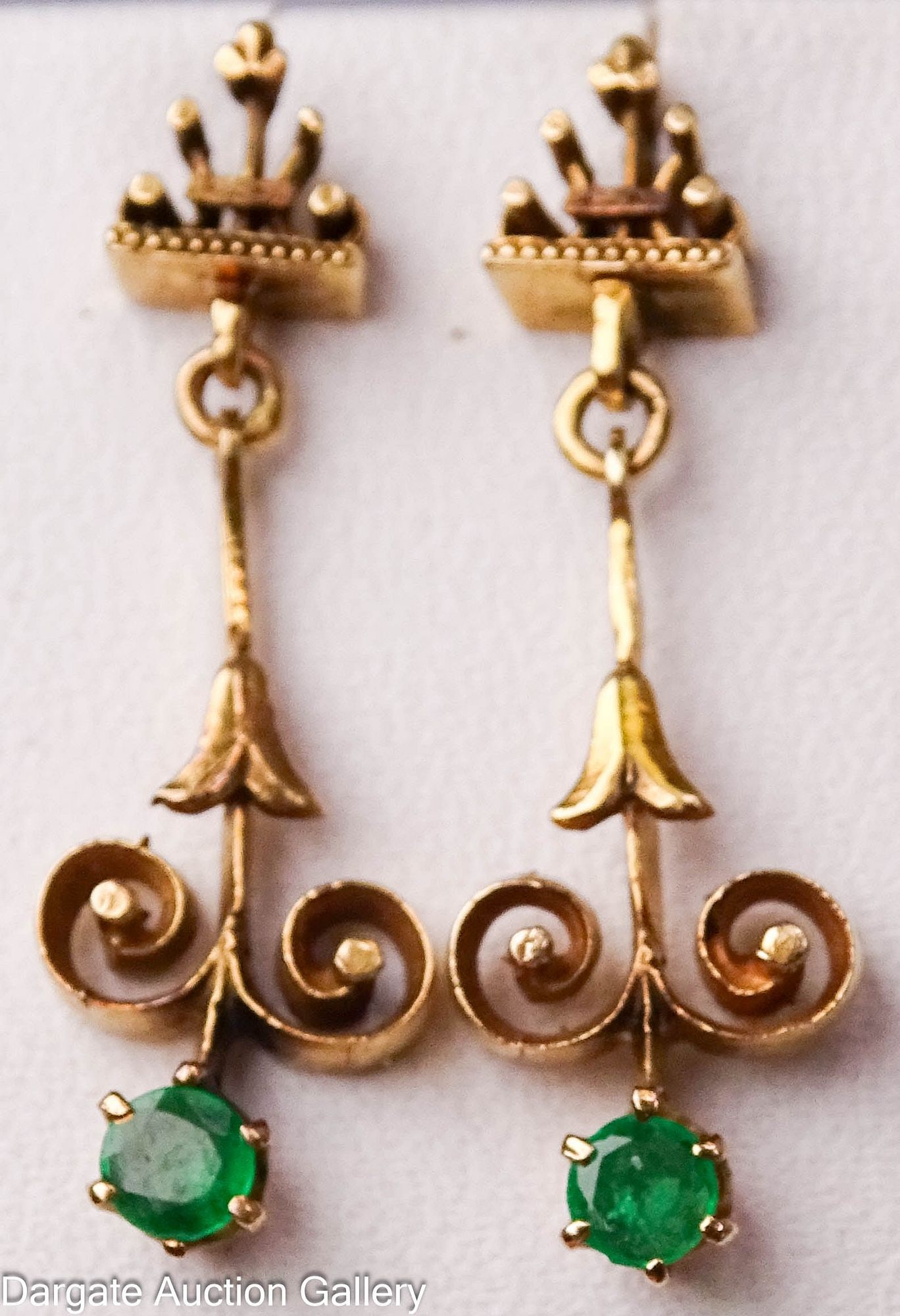 12k YELLOW GOLD EMERALD EARRINGS: 3mm round cut emerald set in 12k yellow gold pierced earrings; Total gross weight - 3.1g